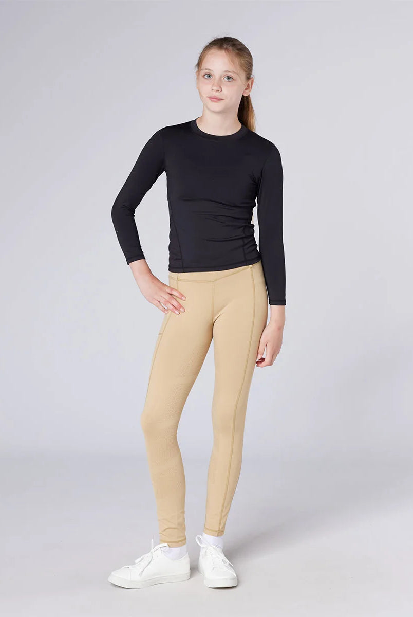CAMEO All Season Riding Tights in Beige worn by a junior rider featuring technical 4-way compression stretch and a high-rise core-supporting waistband. These performance equestrian leggings include a thermal brushed lining and a full-seat silicone chevron grip for security in the saddle.