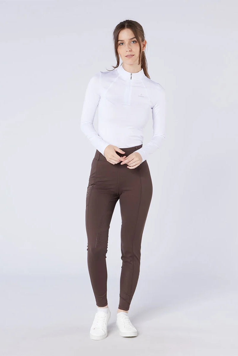CAMEO All Season Tights in Chocolate Brown worn by a rider featuring a high-rise core-supporting waistband and 4-way compression stretch. These technical equestrian riding tights include an innovative full-seat silicone chevron grip and thermal brushed lining for all-weather training in the UK.