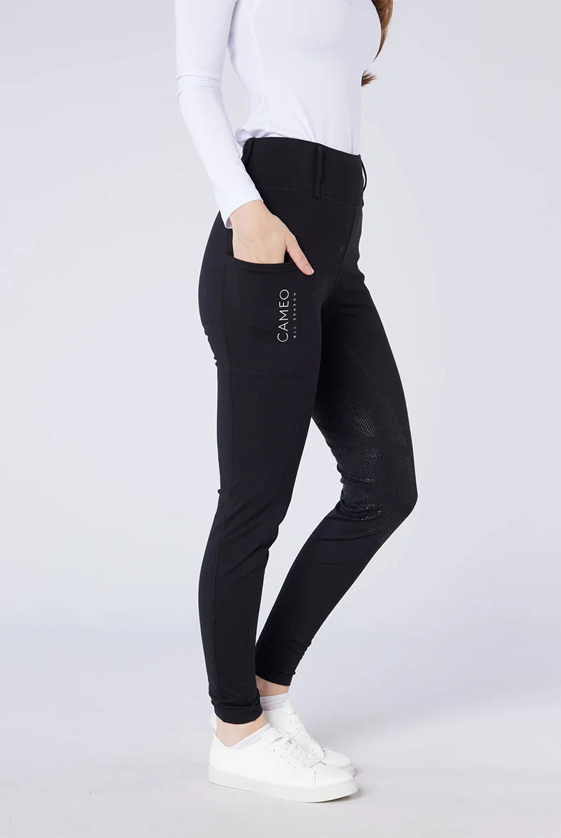 CAMEO All Season Tights in Black featuring a deep ergonomic thigh smartphone pocket and innovative full-seat chevron silicone grip. These high-performance equestrian riding tights include a core-supporting high-rise waistband and thermal brushed fleece lining for all-weather riding in the UK.