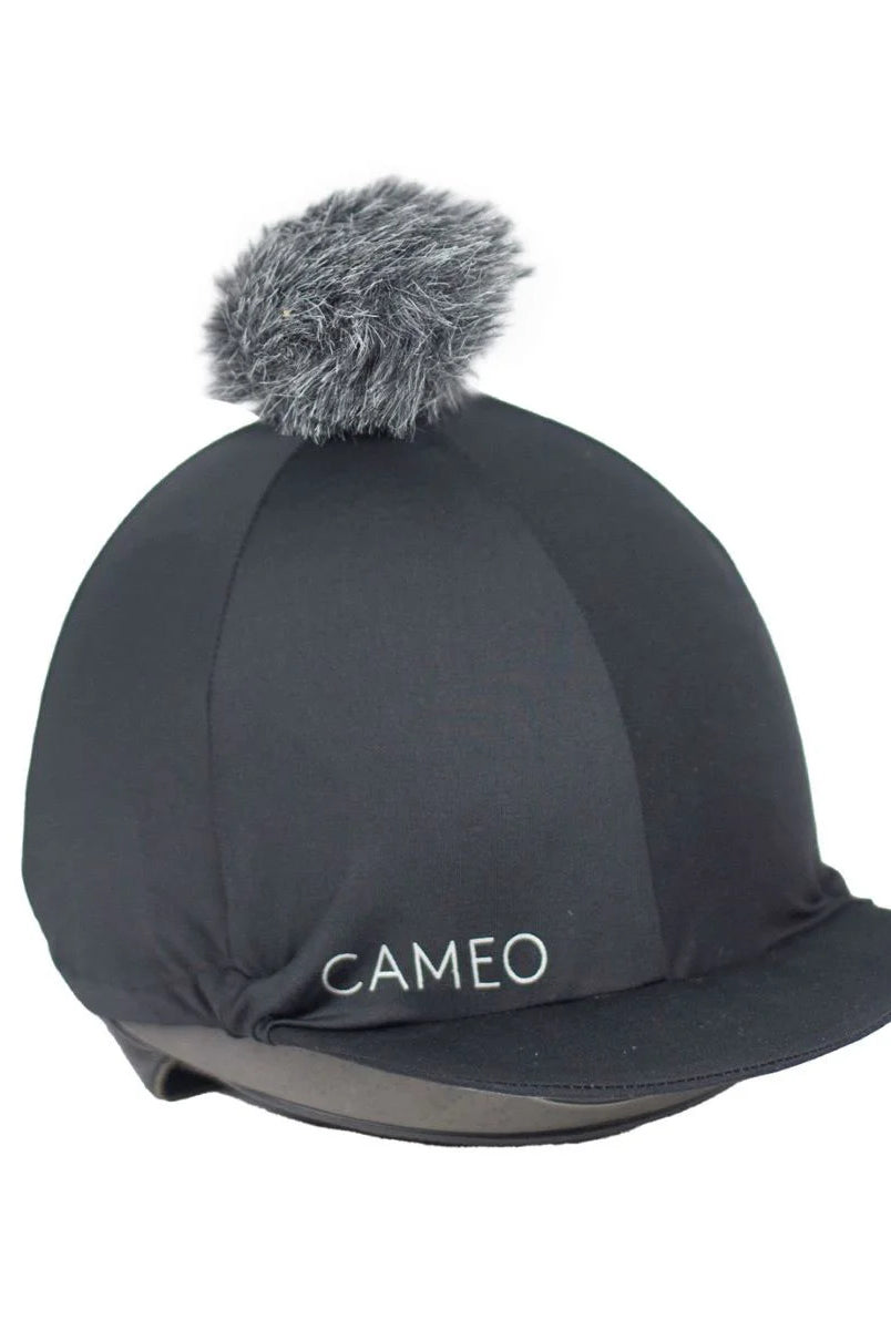 CAMEO Core Hat Silk in Black featuring a grey faux-fur pom-pom and high-performance CameoTech 4-way stretch fabric. This professional equestrian helmet cover offers a wrinkle-free fit over jockey skulls, complete with a flexible peak and secure elastic hem for schooling or competition in the UK.