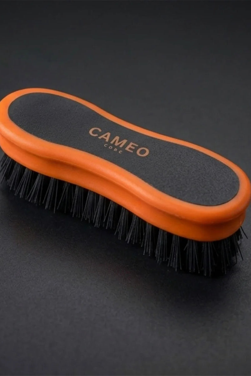 CAMEO Ergonomic Face Brush in Orange on a studio background featuring ultra-soft bristles for gentle equine face grooming.