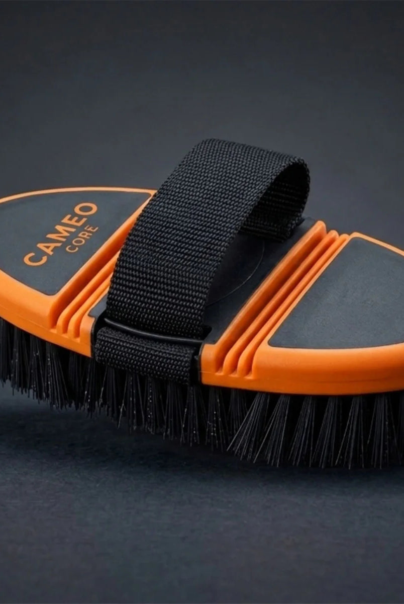 CAMEO Flexi Grooming Brush in Orange featuring an ergonomic bendable spine to comfortably contour around horse body curves.
