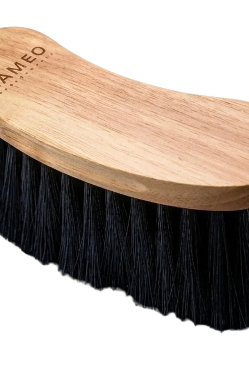 CAMEO Heritage Flick Brush in Natural Wood with an ergonomic curved hardwood back and dense flicking bristle trim.