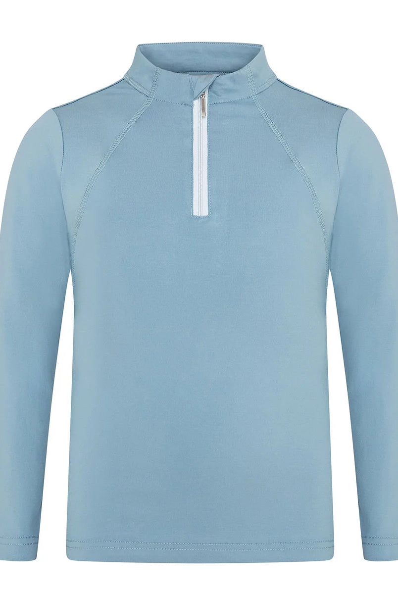 CAMEO Junior Core Baselayer in Cloud Blue featuring a contrast white quarter-zip and technical CameoTech 4-way stretch fabric. This high-performance youth equestrian top provides active thermoregulation, moisture-wicking properties, and ergonomic flat-lock seams for comfort during training and Pony Club.