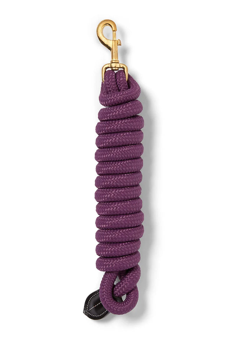 CAMEO Performance Lasso Rope in Purple shown coiled on a white background, showcasing the 16mm multi-filament braided yachting rope, solid brass swivel trigger snap, and stitched leather popper engineered for burn-free grip, youngstock education, and natural horsemanship groundwork control.