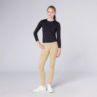 CAMEO All Season Riding Tights in Beige worn by a junior rider featuring technical 4-way compression stretch and a high-rise core-supporting waistband. These performance equestrian leggings include a thermal brushed lining and a full-seat silicone chevron grip for security in the saddle.
