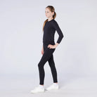 CAMEO All Season Riding Tights in Black worn by a junior rider featuring an innovative full-seat silicone chevron grip and high-rise core-supporting waistband. These technical equestrian leggings provide thermal brushed microfibre warmth and 4-way compression stretch for all-weather riding in the UK.