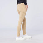 CAMEO All Season Riding Tights in Beige worn by a junior rider, featuring a deep ergonomic thigh smartphone pocket and a full-seat chevron silicone grip for superior in-saddle stability. These technical equestrian leggings include a thermal brushed lining and 4-way compression stretch for UK riders.