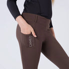 CAMEO All Season Riding Tights in Chocolate Brown featuring a deep ergonomic drop-in smartphone pocket and reflective branding. This close-up highlights the high-rise compressive waistband, reinforced belt loops, and technical 4-way stretch fabric engineered for athletic performance and yard durability.