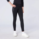 CAMEO All Season Riding Tights in Black featuring a deep thigh smartphone pocket and innovative full-seat chevron silicone grip. Worn by a junior rider, these technical equestrian leggings include a high-rise core-supporting waistband and thermal brushed lining for all-weather training in the UK.