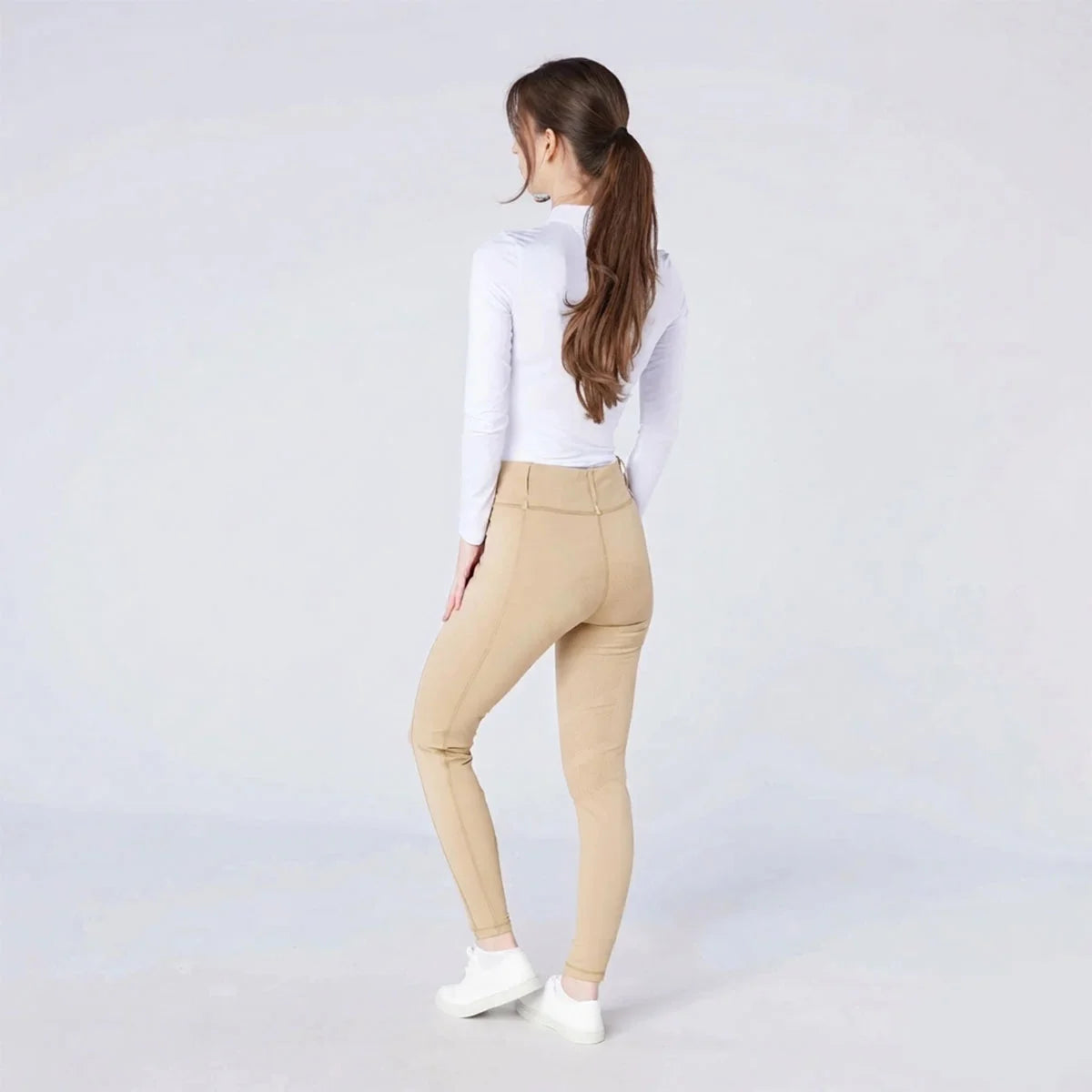 CAMEO All Season Tights in Beige featuring a high-rise core-supporting waistband and an innovative full-seat chevron silicone grip for maximum in-saddle stability. These technical equestrian riding tights include a thermal brushed lining and flat-lock seams for professional UK performance.