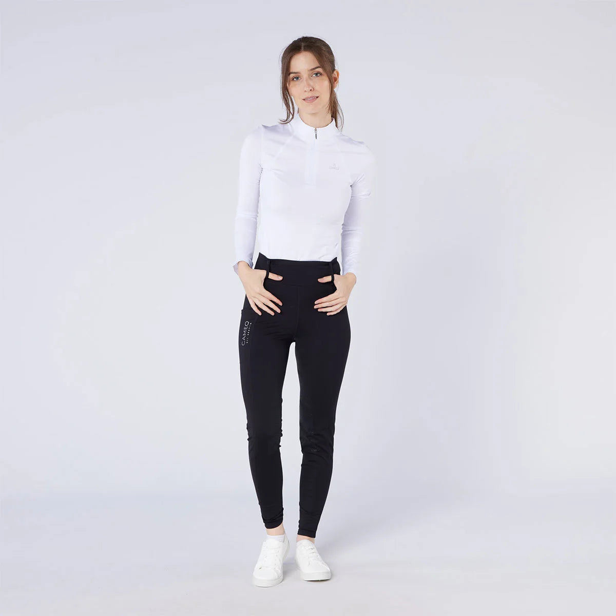CAMEO All Season Tights in Black featuring a high-rise core-supporting waistband and technical 4-way compression stretch. These premium equestrian riding tights include a full-seat chevron silicone grip for in-saddle stability and a thermal brushed fleece lining for all-weather training in the UK.