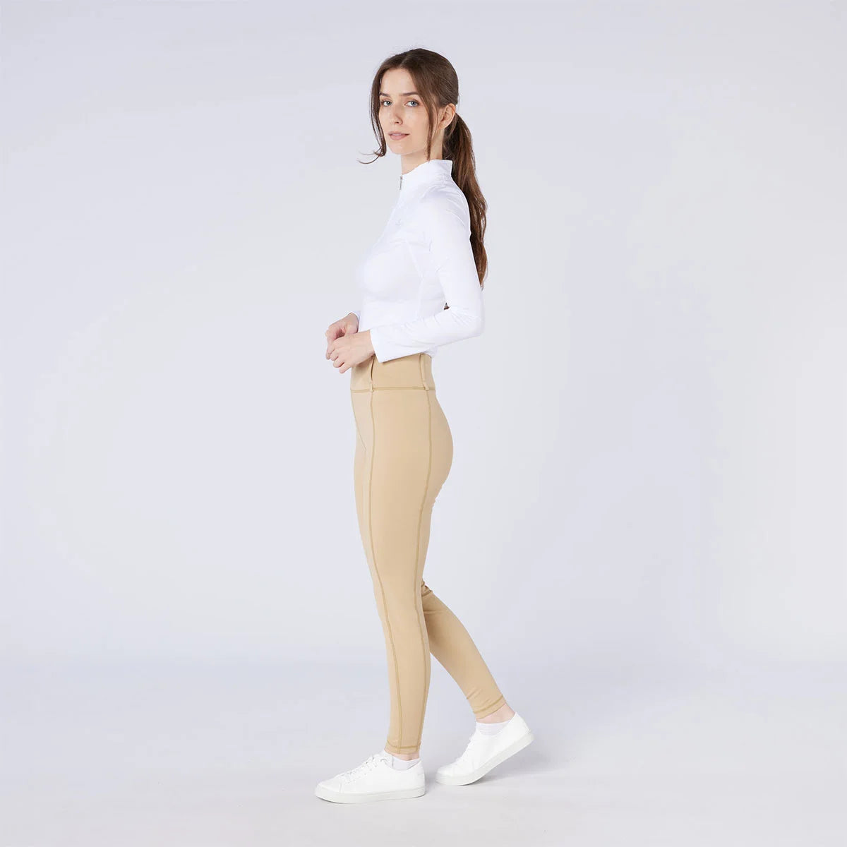 CAMEO All Season Tights in Beige featuring a high-rise core-supporting waistband and an innovative full-seat chevron silicone grip for superior in-saddle stability. These technical equestrian riding tights are engineered with thermal brushed lining and 4-way compression stretch for UK performance.