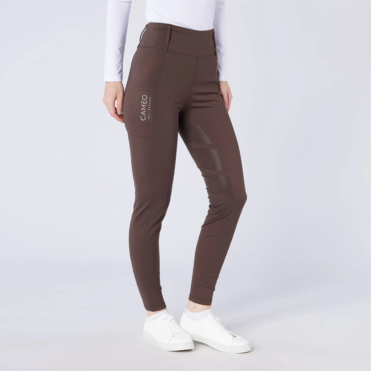 CAMEO All Season Tights in Chocolate Brown featuring a high-rise core-supporting waistband and a full-seat chevron silicone grip for in-saddle stability. These technical equestrian riding tights include a deep smartphone pocket and thermal brushed lining for all-weather training in the UK.