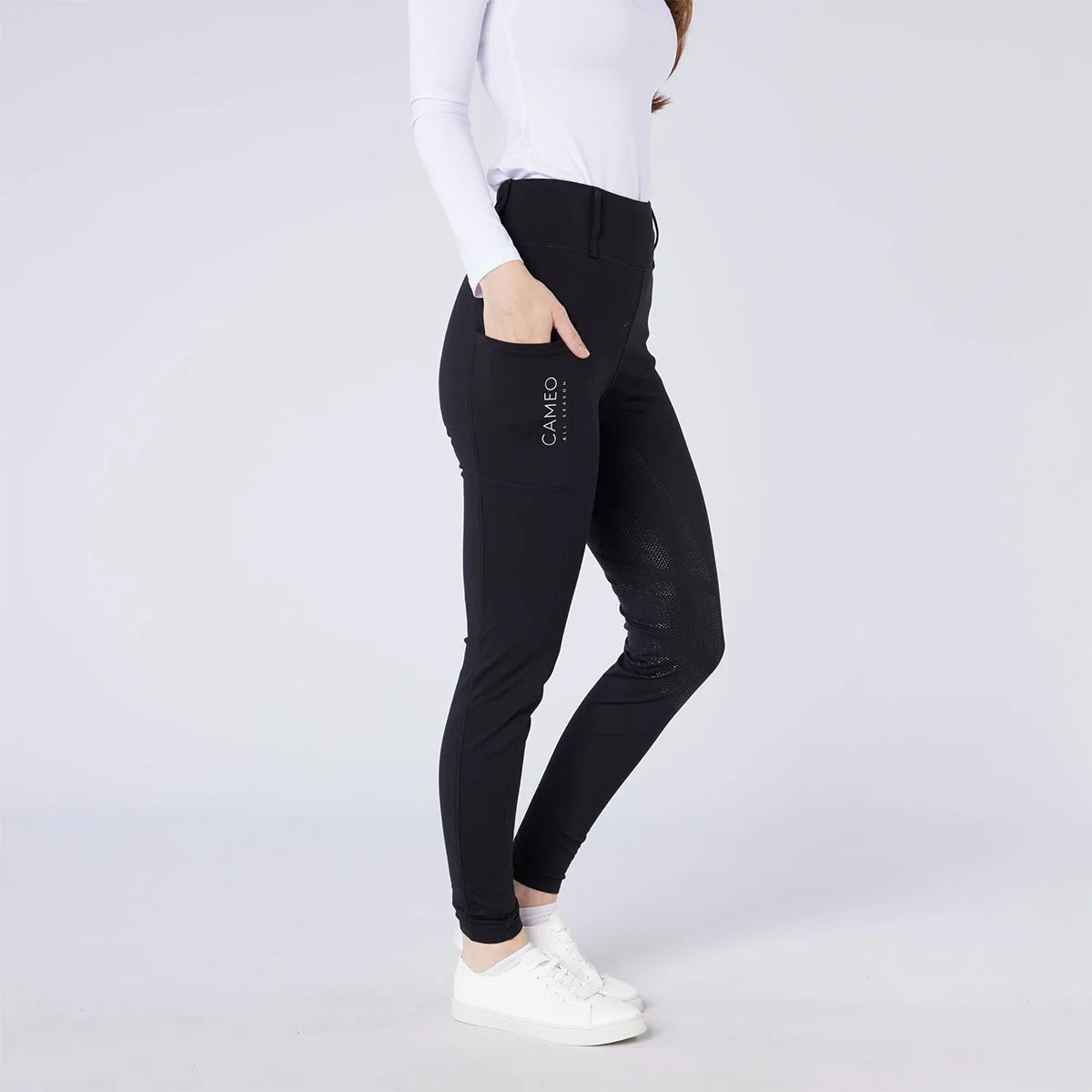 CAMEO All Season Tights in Black featuring a deep ergonomic thigh smartphone pocket and innovative full-seat chevron silicone grip. These high-performance equestrian riding tights include a core-supporting high-rise waistband and thermal brushed fleece lining for all-weather riding in the UK.