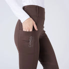 CAMEO All Season Tights in Chocolate Brown featuring a deep ergonomic thigh smartphone pocket and high-rise core-supporting waistband. These technical equestrian riding tights are designed with 4-way compression stretch, thermal brushed lining, and reinforced belt loops for elite performance.