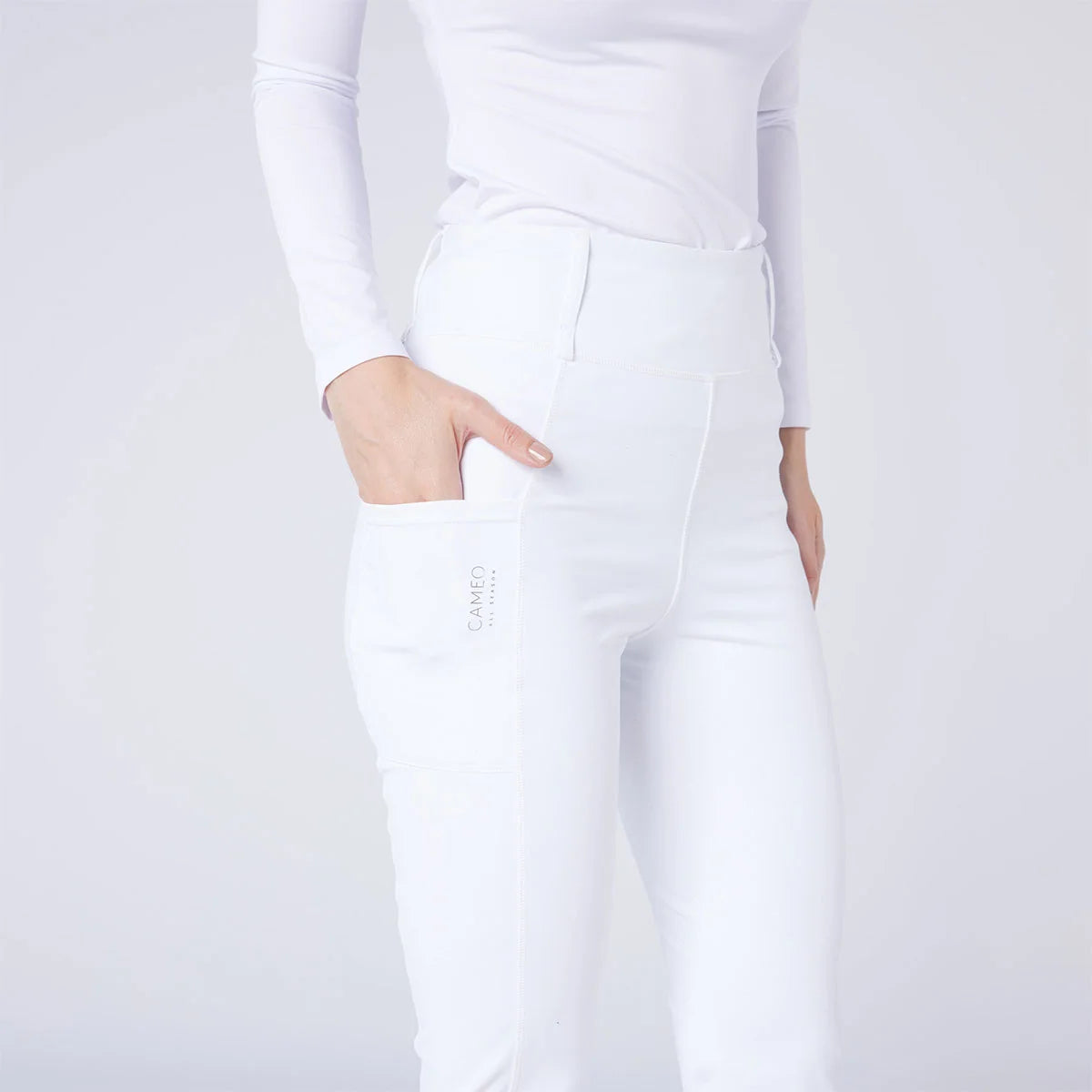 CAMEO All Season Tights in White featuring a deep ergonomic thigh smartphone pocket and high-rise core-supporting waistband. These technical competition riding tights are designed with 4-way compression stretch, thermal brushed lining, and reinforced belt loops for elite equestrian performance.
