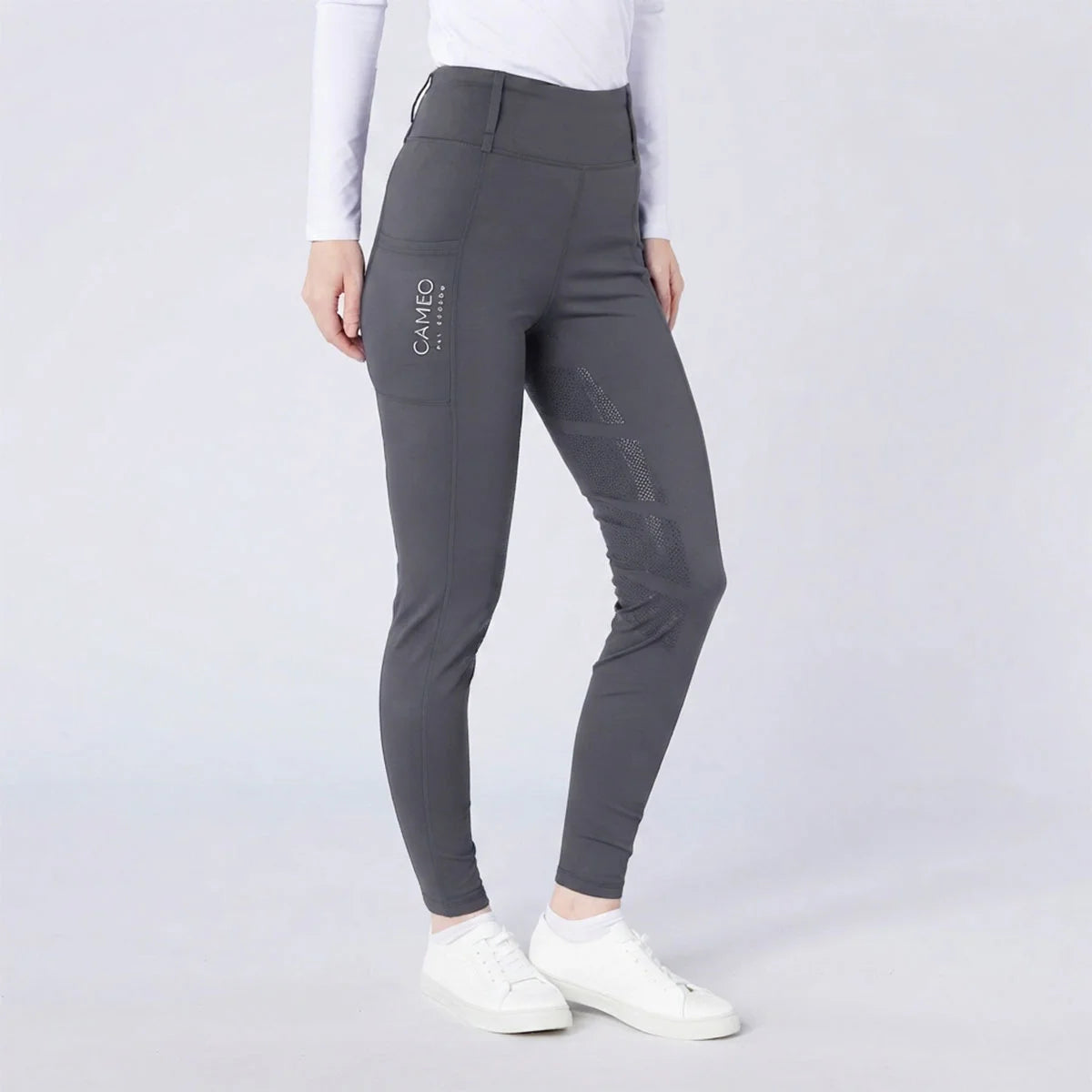 CAMEO All Season Tights in Dark Grey featuring a high-rise core-supporting waistband and a deep ergonomic thigh smartphone pocket. These technical equestrian riding tights are engineered with a full-seat chevron silicone grip, thermal brushed lining, and 4-way compression stretch for professional UK riders.