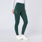 CAMEO All Season Tights in EverGreen featuring a high-rise core-supporting waistband and a deep ergonomic thigh smartphone pocket. These technical equestrian riding tights are engineered with a full-seat chevron silicone grip, thermal brushed lining, and 4-way compression stretch for professional UK riders.
