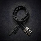 A black leather wrapped competition calfskin stirrup leather coiled on a dark textured background, featuring a silver-toned metal buckle and a visible 'Cameo' brand engraving on the strap end.