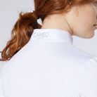 CAMEO Core Collection Baselayer in White showing the reflective silver CAMEO CORE branding on the rear stand collar. This close-up highlights the high-quality technical microfibre fabric and precision flat-lock stitching designed for professional equestrian competition and training comfort.