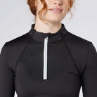 CAMEO Core Collection Baselayer in Black featuring a contrast white quarter-zip and an ergonomic stand collar with a protective zip garage. This technical equestrian top is crafted from high-performance CameoTech 4-way stretch fabric and anti-chafing flat-lock seams for maximum comfort during training.