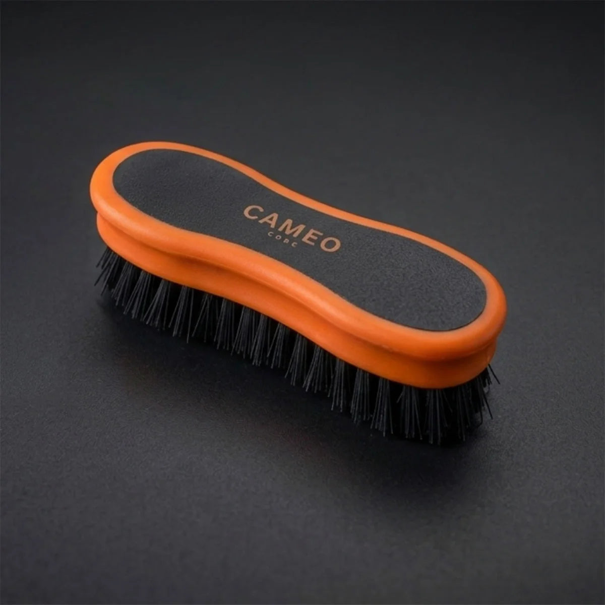 CAMEO Ergonomic Face Brush in Orange on a studio background featuring ultra-soft bristles for gentle equine face grooming.