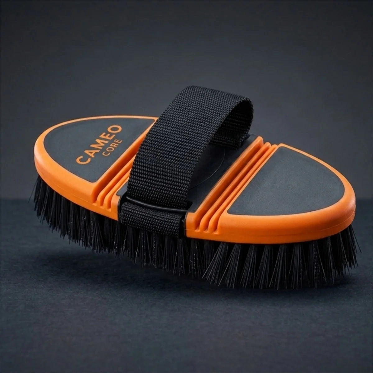 CAMEO Flexi Grooming Brush in Orange featuring an ergonomic bendable spine to comfortably contour around horse body curves.
