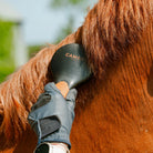 CAMEO Mane & Tail Brush in Orange in use detangling a chestnut horse mane smoothly without pulling or snapping hairs.