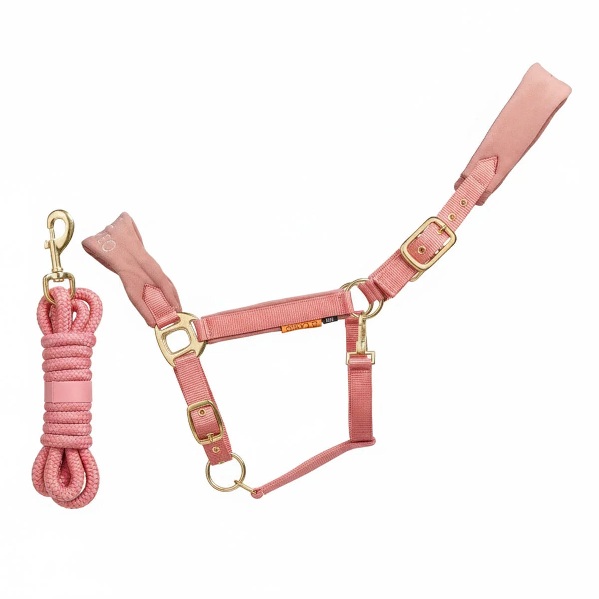 CAMEO Suede Elite Headcollar & Rope set in Dusky Pink shown on a white background, showcasing the broad padded micro-suede noseband, plush crown lining, solid brass hardware, and matching twisted leadrope engineered for nasal pressure dispersal, anti-rub poll comfort, and luxury equestrian travel.
