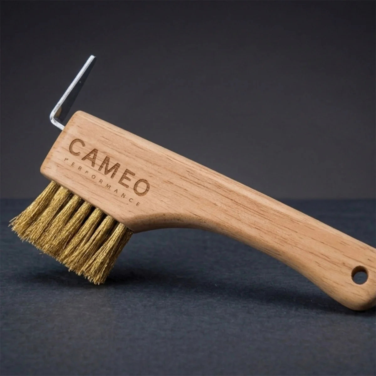 CAMEO The Hoof Hero Elite Edition in Natural Wood on a studio background featuring brass bristles and a solid steel pick.