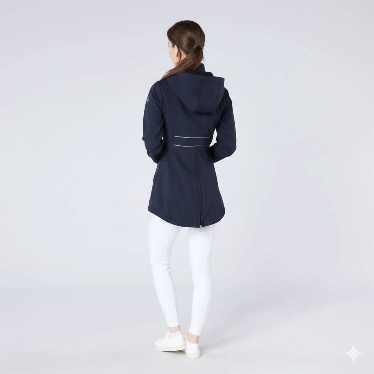CAMEO Zenith Pro Ride Coat in Navy seen from behind on a studio model, showcasing the rear lumbar reflective safety piping, detachable storm hood, and full-length riding gusset zip engineered for visibility on road hacks and in-saddle freedom.