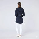 CAMEO Zenith Pro Ride Coat in Navy seen from behind on a studio model, showcasing the rear lumbar reflective safety piping, detachable storm hood, and full-length riding gusset zip engineered for visibility on road hacks and in-saddle freedom.